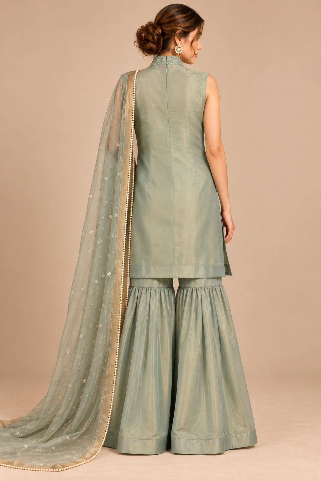 Elysia sage green outfit back view with flared trousers and embellished scarf