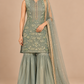 Elysia sage green embroidered outfit front view with flared trousers and sheer scarf