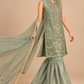 Elysia sage green formal ensemble side view with flowing scarf