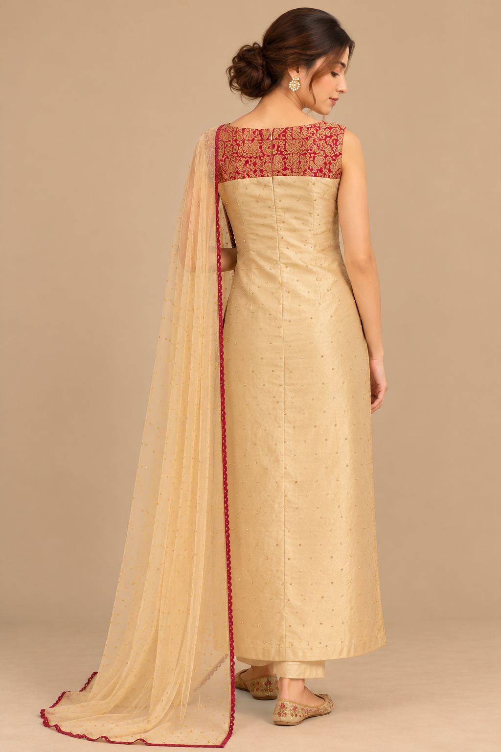 Floral Éclat champagne-gold outfit, rear view showing embroidered fuchsia bodice and sheer scarf