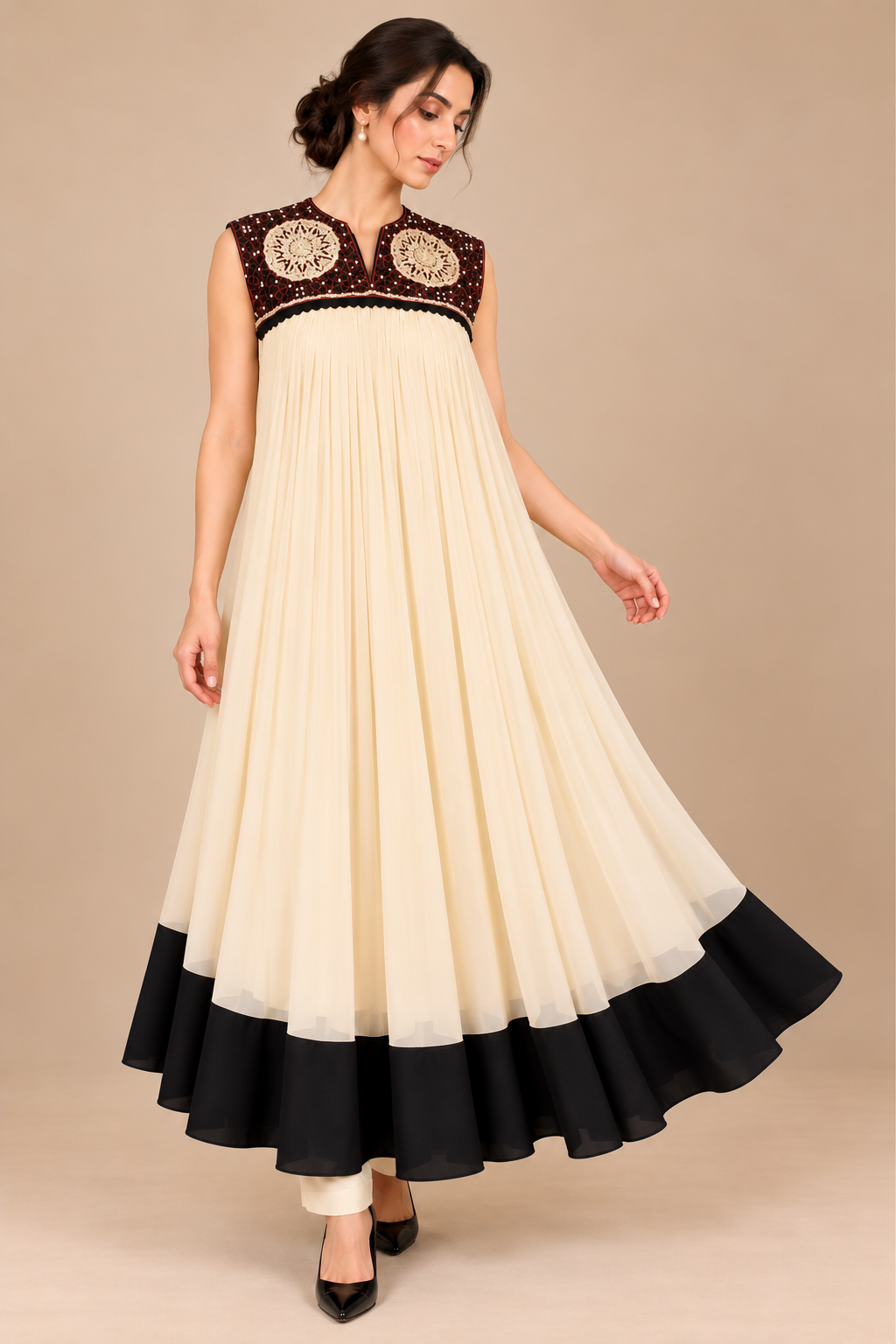 Ivory Noir flowing ivory pleated dress with black hem