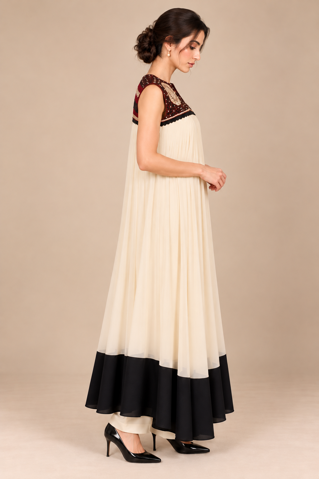 Ivory Noir black hem ivory pleated dress side view